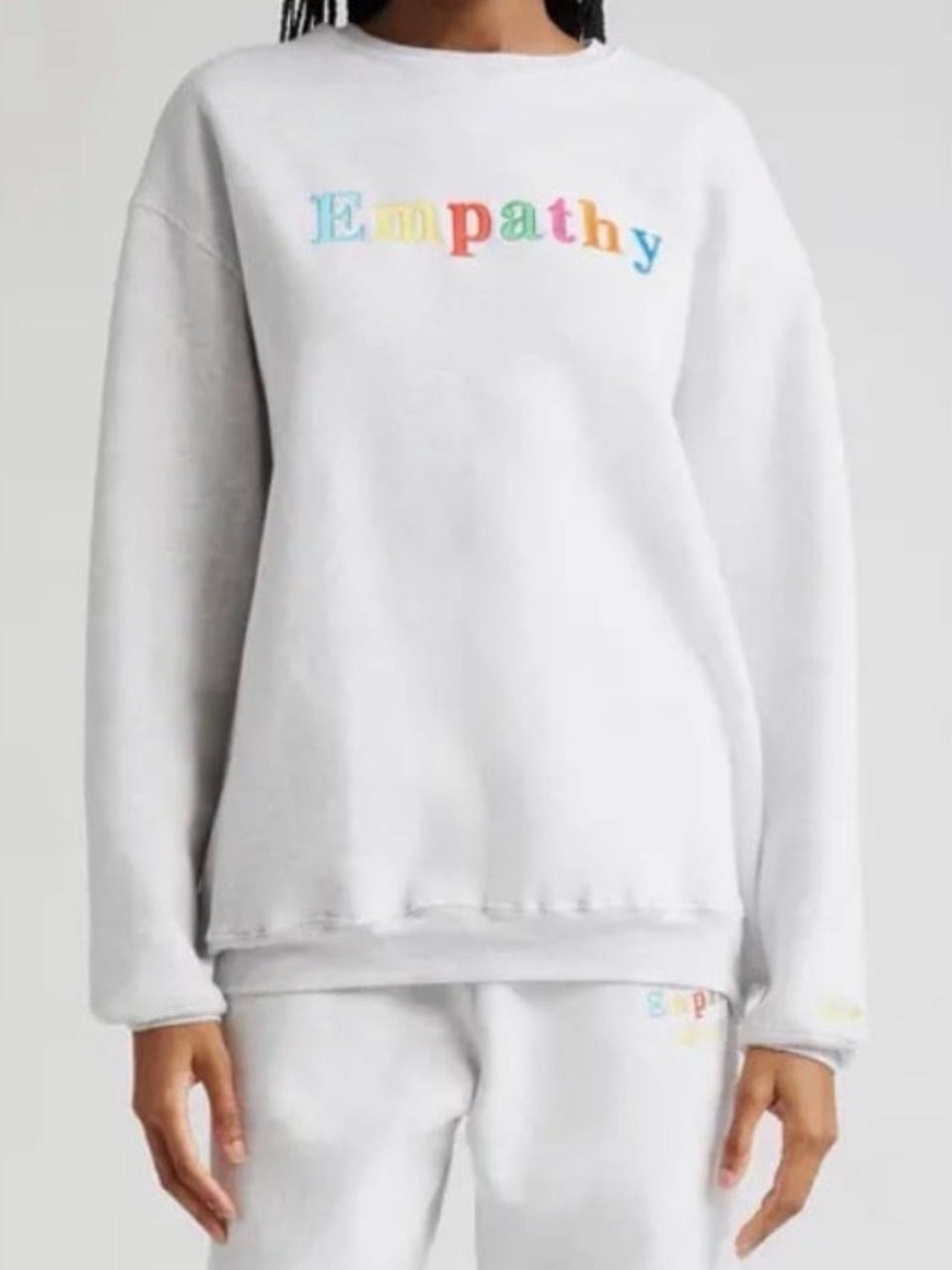 Mayfair Group White 'Empathy' Crewneck Sweatshirt with Rainbow Lettering